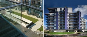 Wandsworth Riverside Quarter Development External Balconies - Lightly glass peened (JDIF No. 66) stainless steel handrail, bonded with structural silicone to toughened glass balustrade panels. - Fabricated and installed by John Desmond Ltd. - Architect: Carey Jones Architects