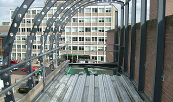The footbridge under construction showing structure for glazed roof.