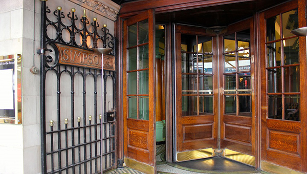 Revolving doors to Simpsons hotel, The Strand, London UK