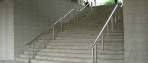 Columbus Courtyard, Canary Wharf, London - Oval, stainless steel handrail with fibre optic downlights and standards fabricated and installed by John Desmond Ltd. - Architect: Koetter Kim Architects