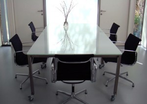 Work table fabricated from shot-peened stainless steel and white glass