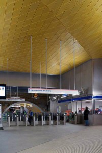 Gold anodised aluminium ceiling to ticket hall.