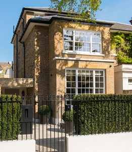 The exterior of 54 Bedford Gardens, Notting Hill, London. Architect: Nash Baker Interior Designer: Desalles Flint Architectural metalworks and PVD coated coloured stainless steel, John Desmond Ltd.