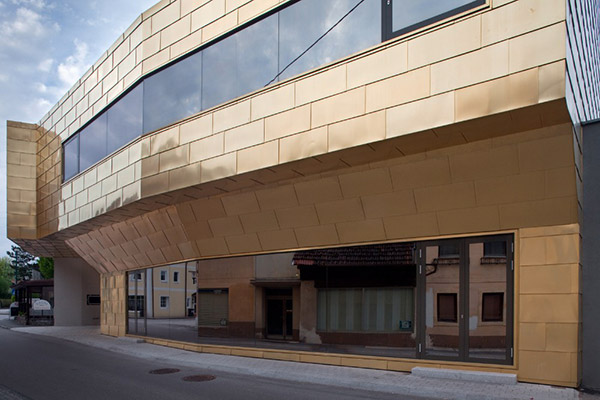 ￼Community Centre façade in Tecu Gold, Wallern, Austria, 2009 by architects Schneider & Lengauer. - ￼Photography by Kurt Hoerbst