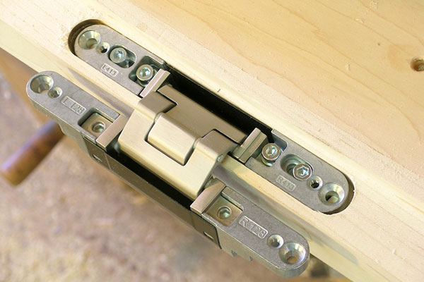 Tectus concealed door hinge. Photo by This is Carpentry
