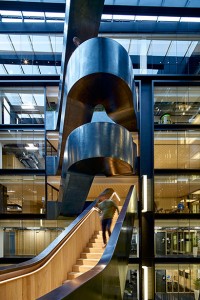 Googlers enjoying the stairs and the view from a half-landing Google offices, 6 Pancras Square, London, UK Photography by Tim Soar