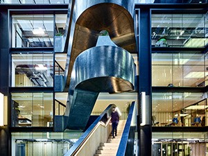 The staircase being accessed from the offices adjacent to the atrium - Google offices, 6 Pancras Square, London, UK - Photography by Tim Soar.