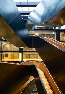 The wax finish on the blackened stainless steel develops as a patina over time. Google offices, 6 Pancras Square, London, UK Photography by Tim Soar