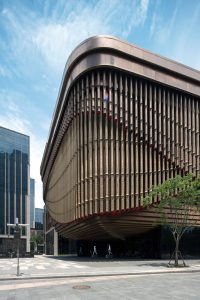 PVD stainless steel in Rose Gold Vibration is used for the spectacular moving veil created from tubes, Shanghai Bund Arts and Cultural Centre. - Architects: Foster & Partners; Heatherwick Studio - PVD: John Desmond Ltd in partnership with Double Stone Steel, Photography by Tim Franco.