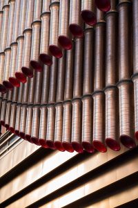 A close-up view of the façade of the Shanghai Bund Arts and Cultural Centre made from PVD stainless steel in Rose Gold Vibration. Architects: Foster & Partners; Heatherwick Studio PVD: John Desmond Ltd, Photography by Tim Franco.