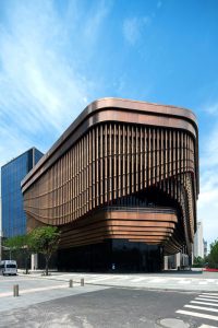 The Shanghai Bund Arts and Cultural Centre showing the moving veil and viewing gallery façade fabricated from PVD stainless steel in Rose Gold Vibration. Architects: Foster & Partners; Heatherwick Studio PVD: John Desmond Ltd, Photography by Tim Franco.