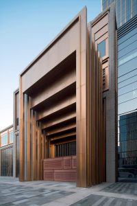 PVD stainless steel in Rose Gold Vibration was specified for door entries to create a sumptuous effect. Shanghai Bund Financial Centre. Architects: Foster & Partners; Heatherwick Studio PVD: John Desmond Ltd