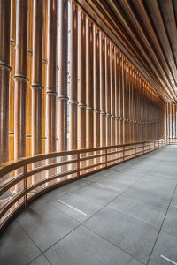 The interior walkway looking from the inside at the façade of the Shanghai Bund Arts and Cultural Centre. Façade fabricated from PVD stainless steel in Rose Gold Vibration. Architects: Foster & Partners; Heatherwick Studio PVD: John Desmond Ltd, Photography by Tim Franco.