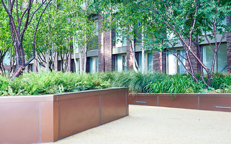 Embassy Gardens, London UK – planters in Bronze sandblasted PVD stainless steel