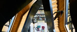 Staircase in blackened stainless steel with over-wax finish for Google, 6 Pancras Square, London, UK - Architects: AHMM - Main contractor: ISG - Staircase fabrication, installation and finishing: John Desmond Ltd - Structural engineers for John Desmond Ltd: AECOM - Showing view from below the stairs. - Photography by Tim Soar