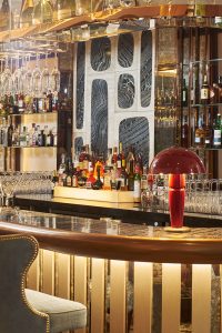 Close-up of the bar in The Champagne Bar, The Devonshire Club Hotel Interior Design: March & White PVD coloured stainless steel: John Desmond Ltd