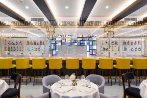 The bar in The Brasserie. The Devonshire Club Hotel Interior Design: March & White PVD coloured stainless steel: John Desmond Ltd
