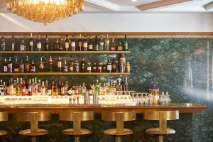 Close-up of the bar in The Champagne Bar. The Devonshire Club Hotel Interior Design: March & White PVD coloured stainless steel: John Desmond Ltd