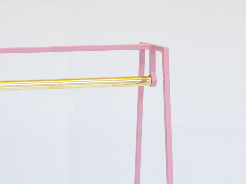 &New's 'A' clothes rail in pink with a brass rail