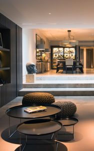 Home cinema looking through to dining/wine-tasting area. Bedford Gardens, London. Architects: Nash Baker Interior Designers: DeSalles Flint Architectural metalwork & PVD stainless steel: John Desmond Ltd