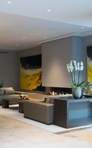 Relaxed sitting area with large format paintings. Bedford Gardens, London. Architects: Nash Baker Interior Designers: DeSalles Flint Architectural metalwork & PVD stainless steel: John Desmond Ltd