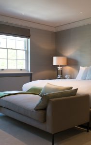 Bedroom with contemporary chaise longue. Bedford Gardens, London. Architects: Nash Baker Interior Designers: DeSalles Flint Architectural metalwork & PVD stainless steel: John Desmond Ltd