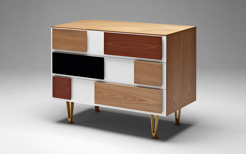 Chest of drawers by Molteni & C with a variety of timbers in rounded-off decorative rectilinear panels on the drawers. Designed by Gio Ponti. Note the characteristic wide spacing between the panels.