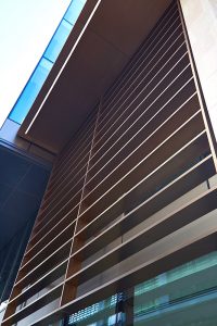 Detail of the Brise soleil fins and verticals. 15 Fetter Lane, EC4A, London. PVD coloured stainless steel Brise soleil, canopy and column. John Desmond Ltd.