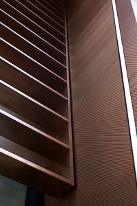 Detail of the V-grooved hollow fins and column. 15 Fetter Lane, EC4A, London. PVD coloured stainless steel Brise soleil, canopy and column. John Desmond Ltd.