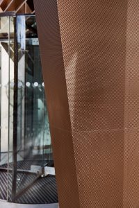Detail of the tapered column. 15 Fetter Lane, EC4A, London. PVD coloured stainless steel Brise soleil, canopy and column. John Desmond Ltd.