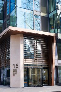 The new entrance façade. 15 Fetter Lane, EC4A, London. PVD coloured stainless steel Brise soleil, canopy and column. John Desmond Ltd.