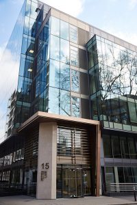 The new entrance façade from Fetter Lane. 15 Fetter Lane, EC4A, London. PVD coloured stainless steel Brise soleil, canopy and column. John Desmond Ltd.