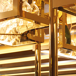 V-grooved and folded Double Stone Steel PVD stainless steel in Brass Mirror for glass rack over bar, Devonshire Club Hotel, London.