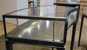 Display case in a variation on Bronze, created as a bespoke colour for the client