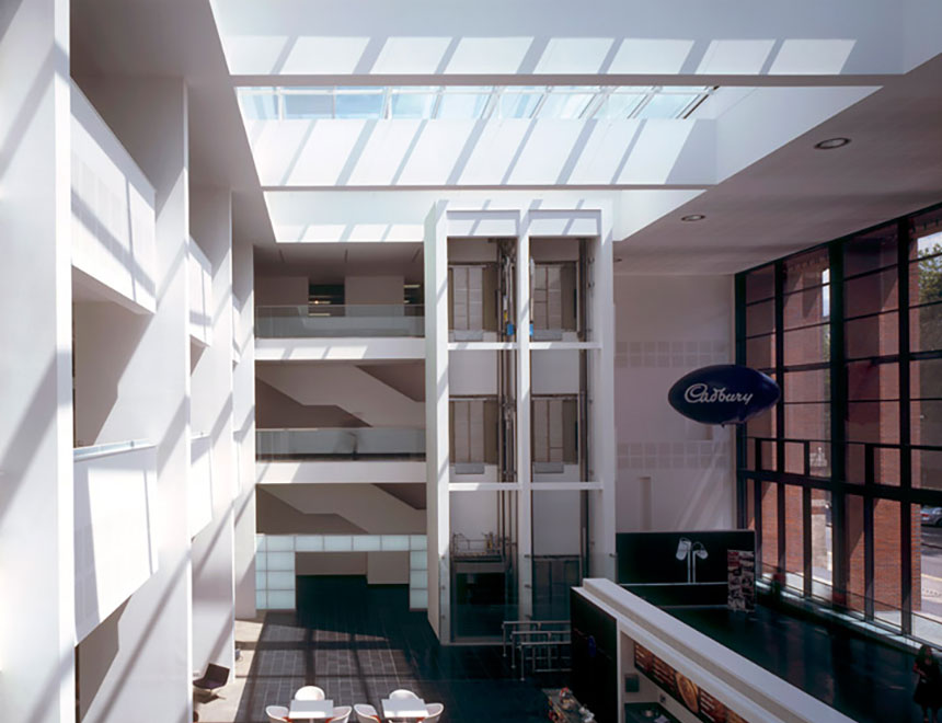The mesh solar shading allows the lower glazed sections to have clear views. Cadbury Dining Block, Birmingham by Stanton Williams Architects, Weedon Architects.