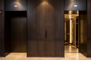 Architrave and panels for elevator and lobby in electro-zinc coated V-Grooved stainless steel Fenman House, Apartment Building, 9 Handyside St, King’s Cross, London N1C Manufacture by Bluecoat Engineering - Fabrication, V-Grooving and folding of stainless steel by John Desmond Ltd - Building design by Maccreanor Lavington Architects - Interiors by Johnson Naylor Architects - Developer: Argent