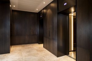 A streamlined, harmonious look is achieved using architrave and trim in Bronze finished stainless steel with Wenge cladding panels. Elevator architrave and panels in V-Grooved electro-zinc coated stainless steel Fenman House, Apartment Building, 9 Handyside St, King’s Cross, London N1C Design by Johnson Naylor Architects Manufacture by Bluecoat Engineering Fabrication, V-Grooving and folding of stainless steel by John Desmond Ltd