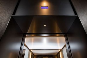 A sleek, streamlined look was achieved using trim and architrave that has been folded via the V-Grooving process which creates the look of solid material. Elevator architrave and panels in V-Grooved electro-zinc coated stainless steel Fenman House, Apartment Building, 9 Handyside St, King’s Cross, London N1C Design by Johnson Naylor Architects Manufacture by Bluecoat Engineering Fabrication, V-Grooving and folding of stainless steel by John Desmond Ltd