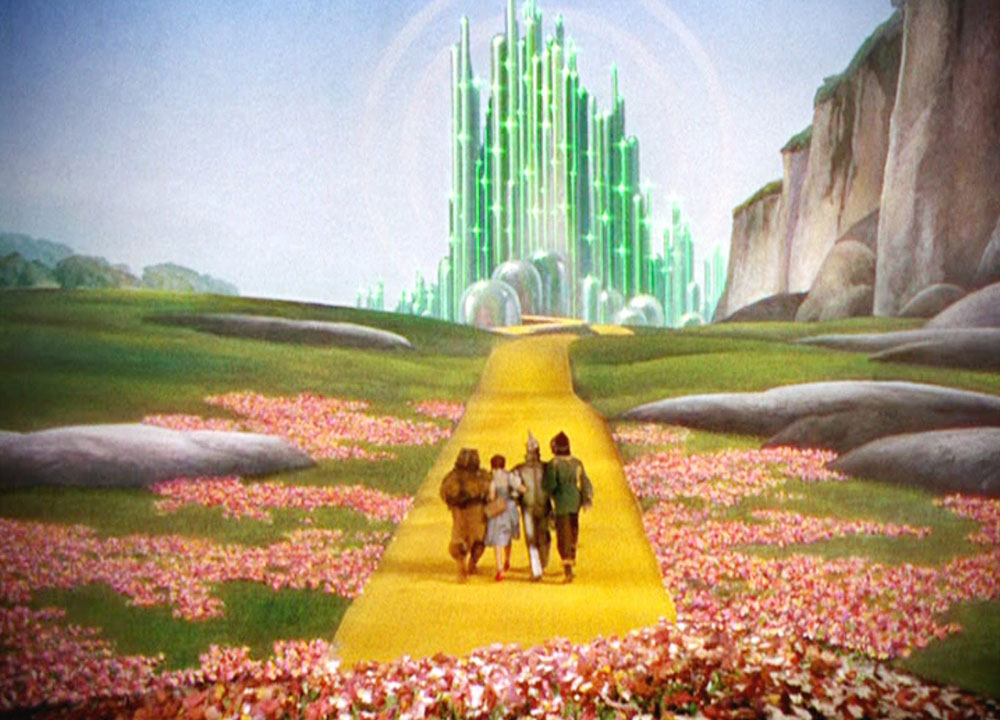 Still from MGMs 1939 musical ‘The Wizard of Oz’ with the green towers of the Emerald City in the distance