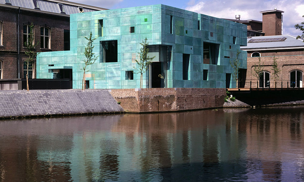 Pre-aged copper cladding panels to the Sarphatistraat Offices in Amsterdam by Steven Holl;