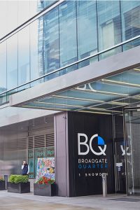 Frameless Glazed Satin Stainless Steel Canopy. 1 Broadgate Quarter, Snowden St, London, EC2A 2AW - Architects: John Robertson Architects. - Stainless Steel Canopy: John Desmond Ltd - Showing the new canopy design creating a contemporary and streamlined entrance area.