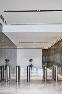 1 Broadgate Quarter, Snowden St, London, EC2A 2AW - Architects: John Robertson Architects. - Stainless Steel Canopy: John Desmond Ltd. - Within the building juxtaposed with the smooth finishes of the wall and floor is a feature wall comprising narrow brass bars.
