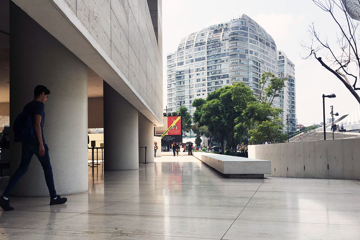 The Jumex Museum, Mexico City is clad in travertine stone from Xalapa, Veracruz, Mexico and is supported by large columns resting on an elevated piazza. Photograph by Antonio Moll.