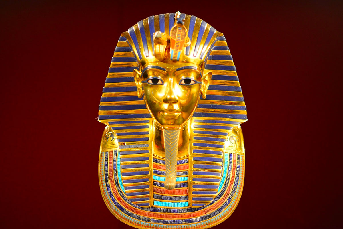 The death mask of Egyptian Pharaoh Tutankhamun. The mask was discovered in 1922 by British archeologist Howard Carter, and is predominantly made from gold with cobalt blue glass.