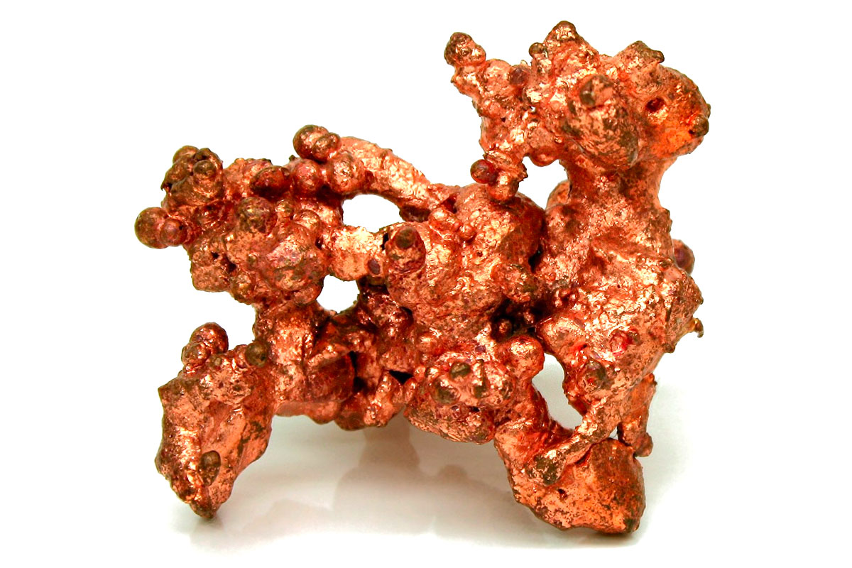 A piece of the metallic element, copper. It has a distinctive reddish, orange colour and is one of the few metals to occur in nature in a directly usable form.