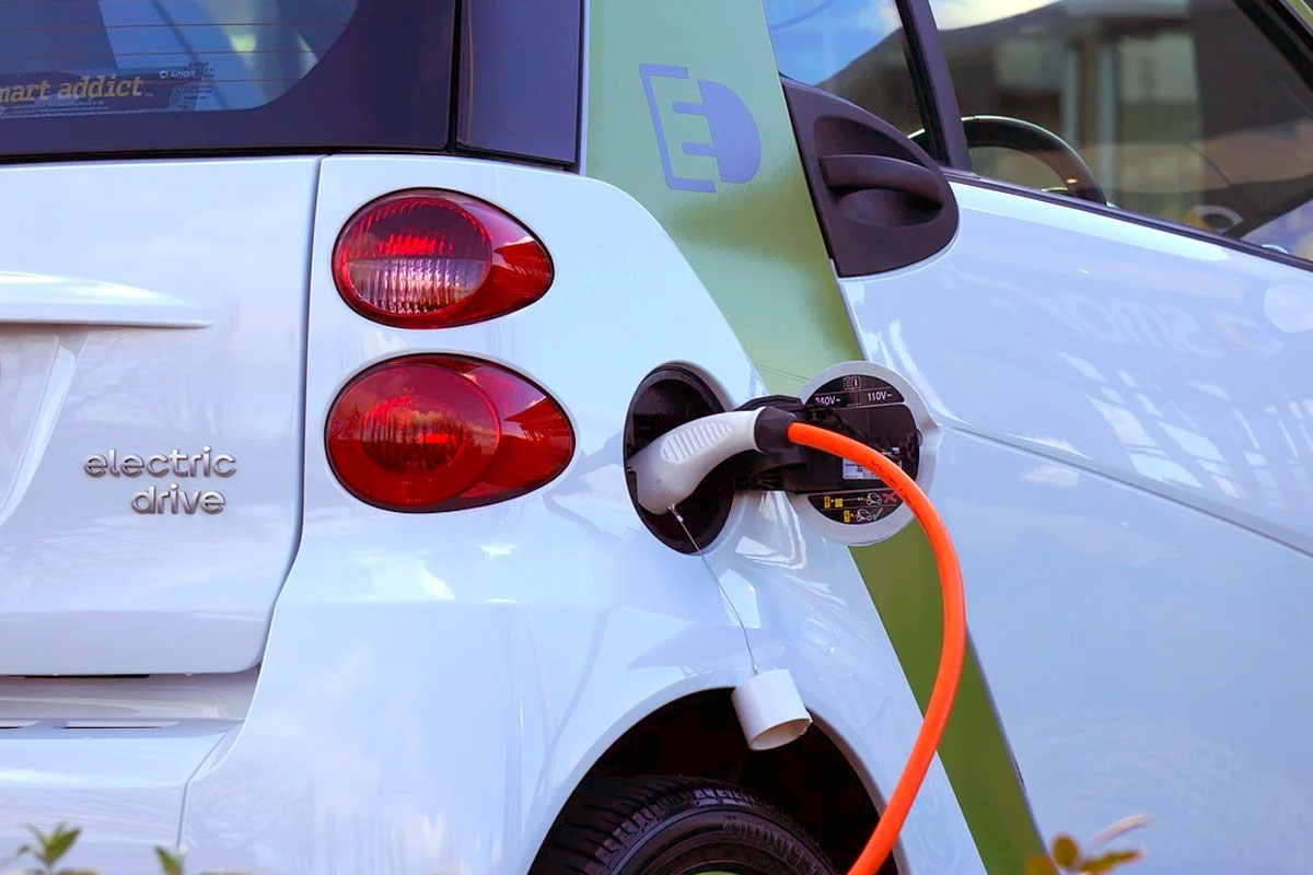 An electric car plugged into a charger. Electric vehicles use 3.6 times more copper than conventional vehicles as the metal is a vital component of electric motors and batteries.