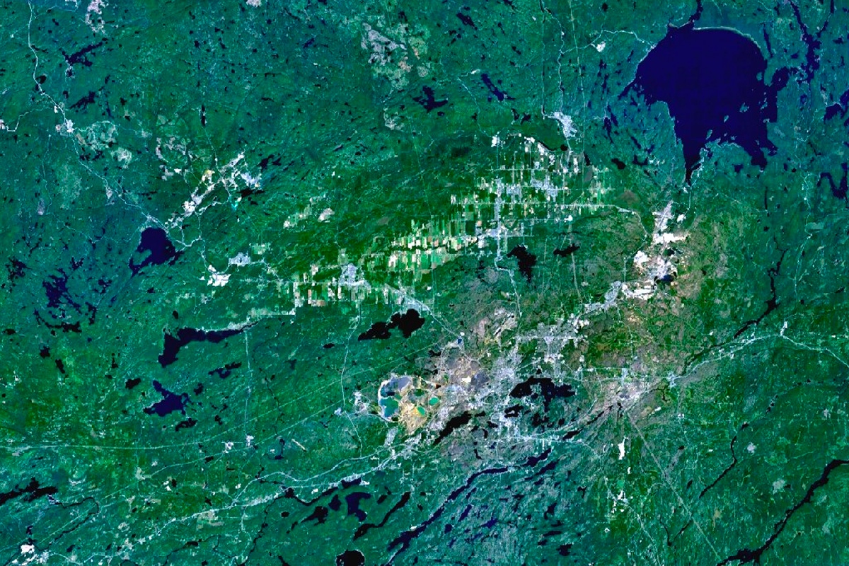 The Sudbury and Wanapitei impact craters in Ontario, Canada were created by asteroids crashing into the earth billions of years ago. The nickel-rich Sudbury Basin is the large, elliptical structure (60 x 30 km).