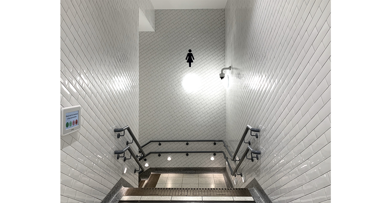 The wide entrance helps to keep traffic on the stairwell to the minimum and sets the tone for the spacious facilities downstairs. London Victoria Rail Station WC. - Architects Landolt + Brown. Fit out contractor Maxwood Washrooms.