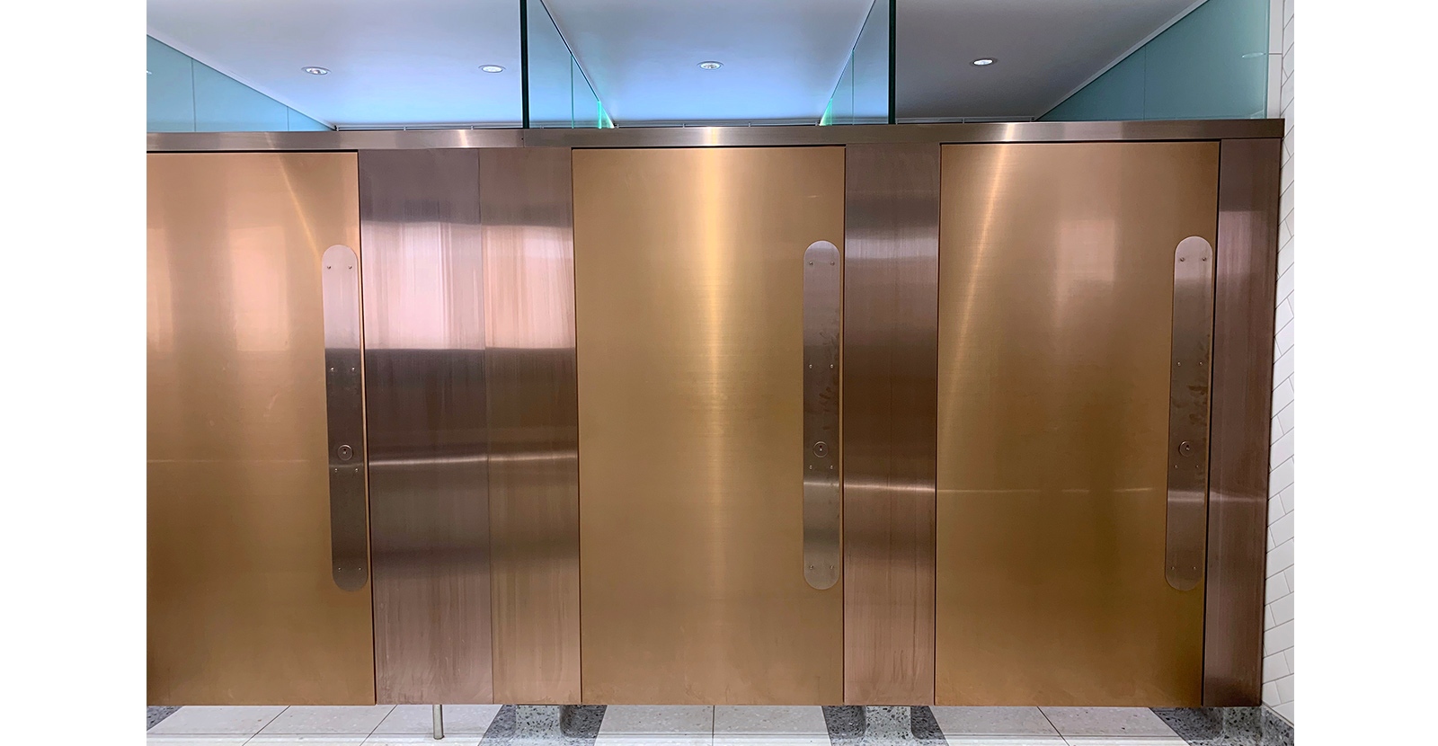 By using two finishes for the cubicle doors and dividers, there is a clear distinction for those with visual impairments. London Victoria Rail Station WC. - Architects Landolt + Brown. Fit out contractor Maxwood Washrooms.