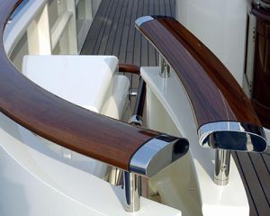 Polished timber hand rail with chrome finish end-caps and struts.